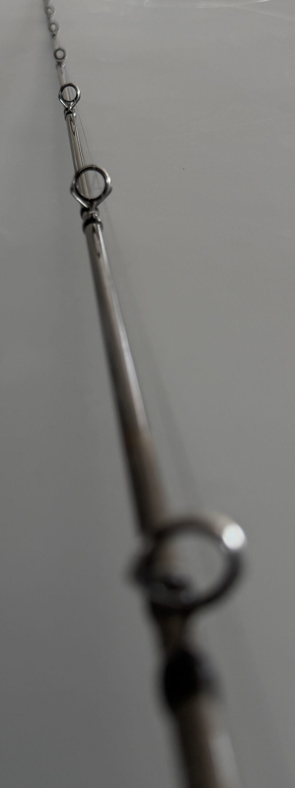 Progressive guide spacing on a custom fishing rod blank