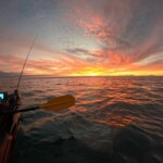 Kayak fishing at sunrise in New Zealand with K-Labs fishing rod
